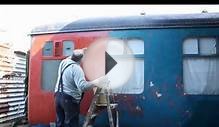 bob painting railcar at county school on the mid norfolk